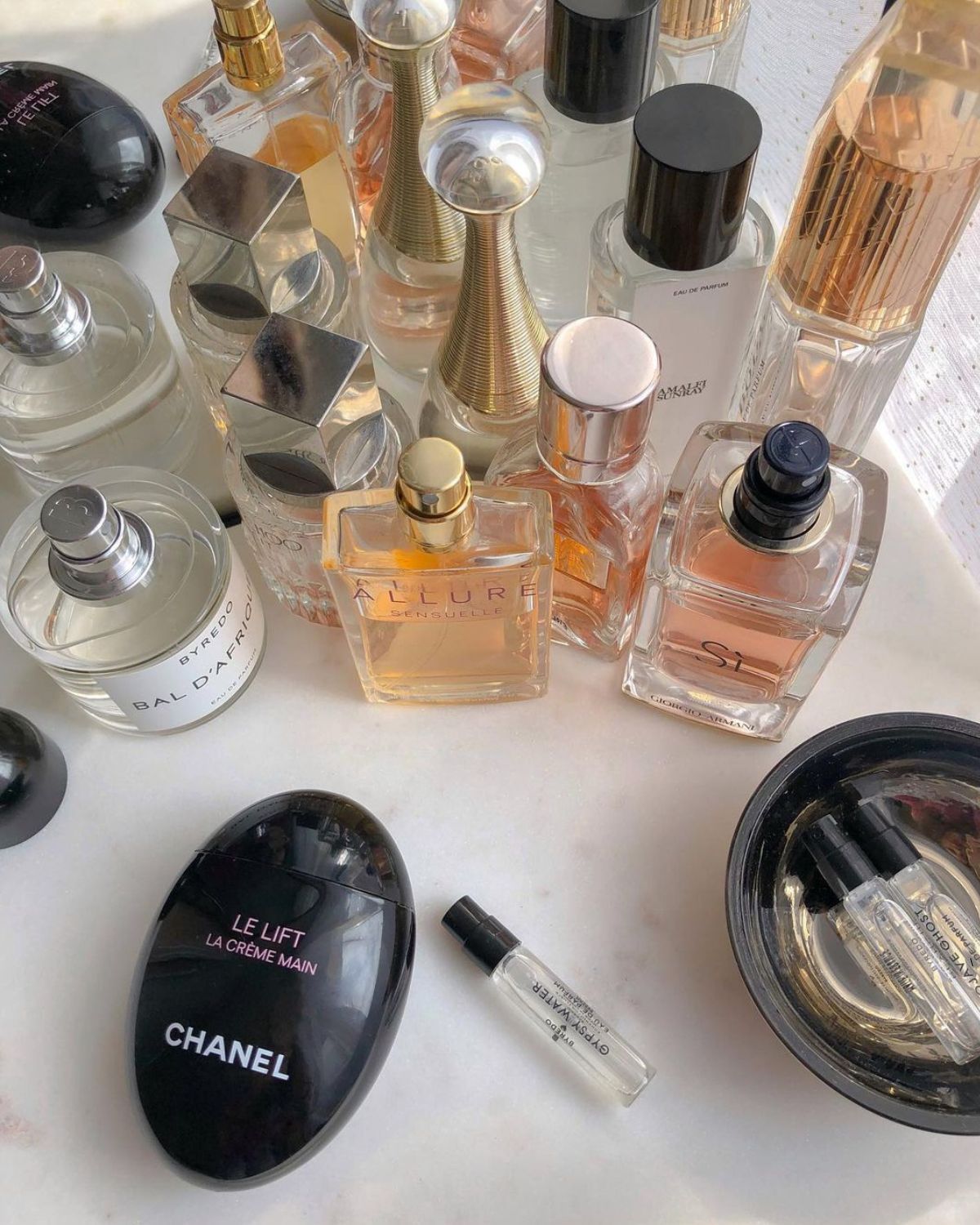 Designer perfume bottles on a counter.