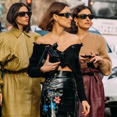 street style photo of three stylish Italian women wearing trendy designer clothes