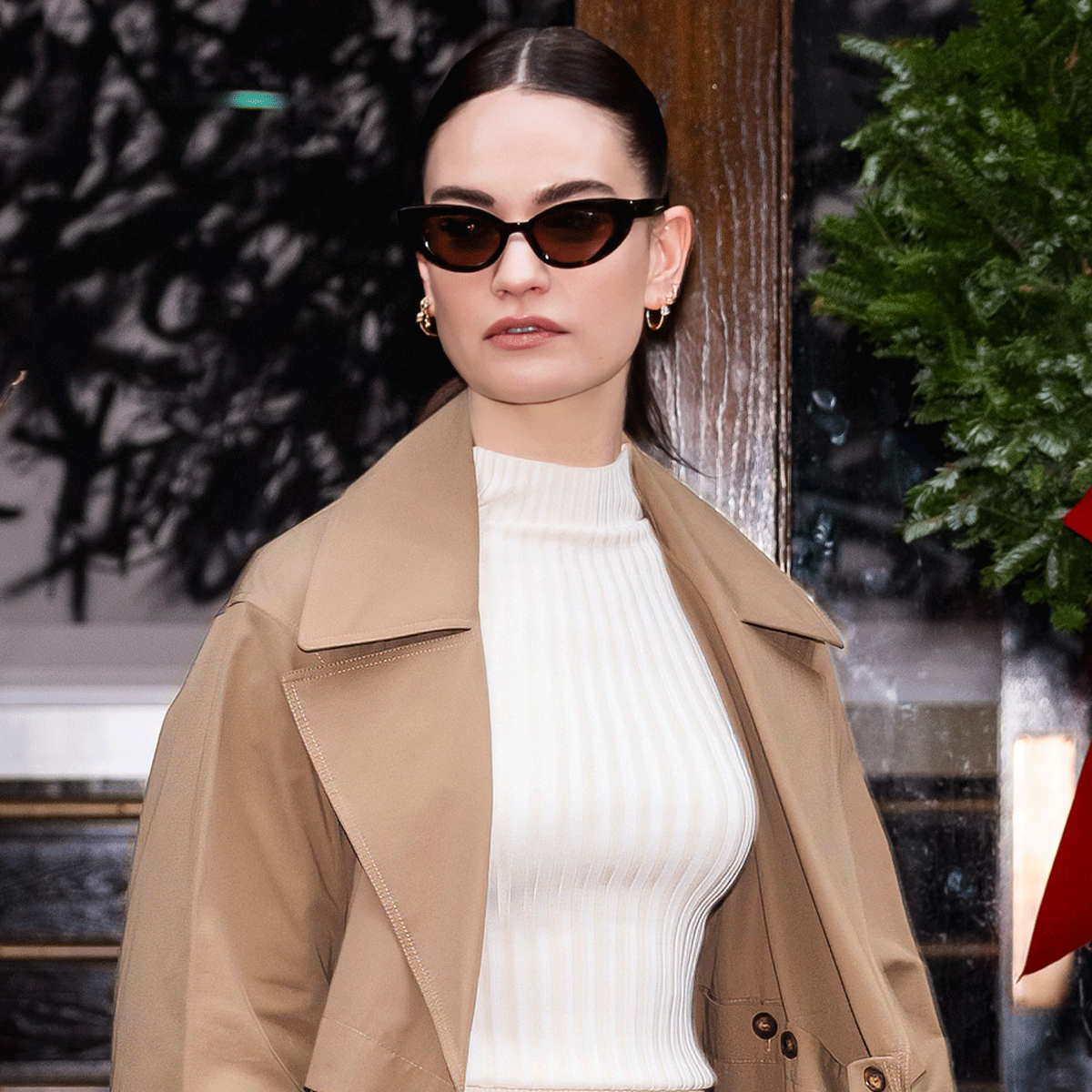 Lily James Wore The Perfect Winter Boot Outfit In NYC Who What Wear lily-james-wore-the-perfect-winter-boot-outfit-in-nyc-who-what-wear