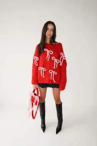 Hope MacAulay + Red Chunky Bow Knit Sweater