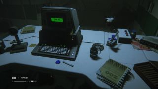 A computer with a CRT monitor waiting for a sign in