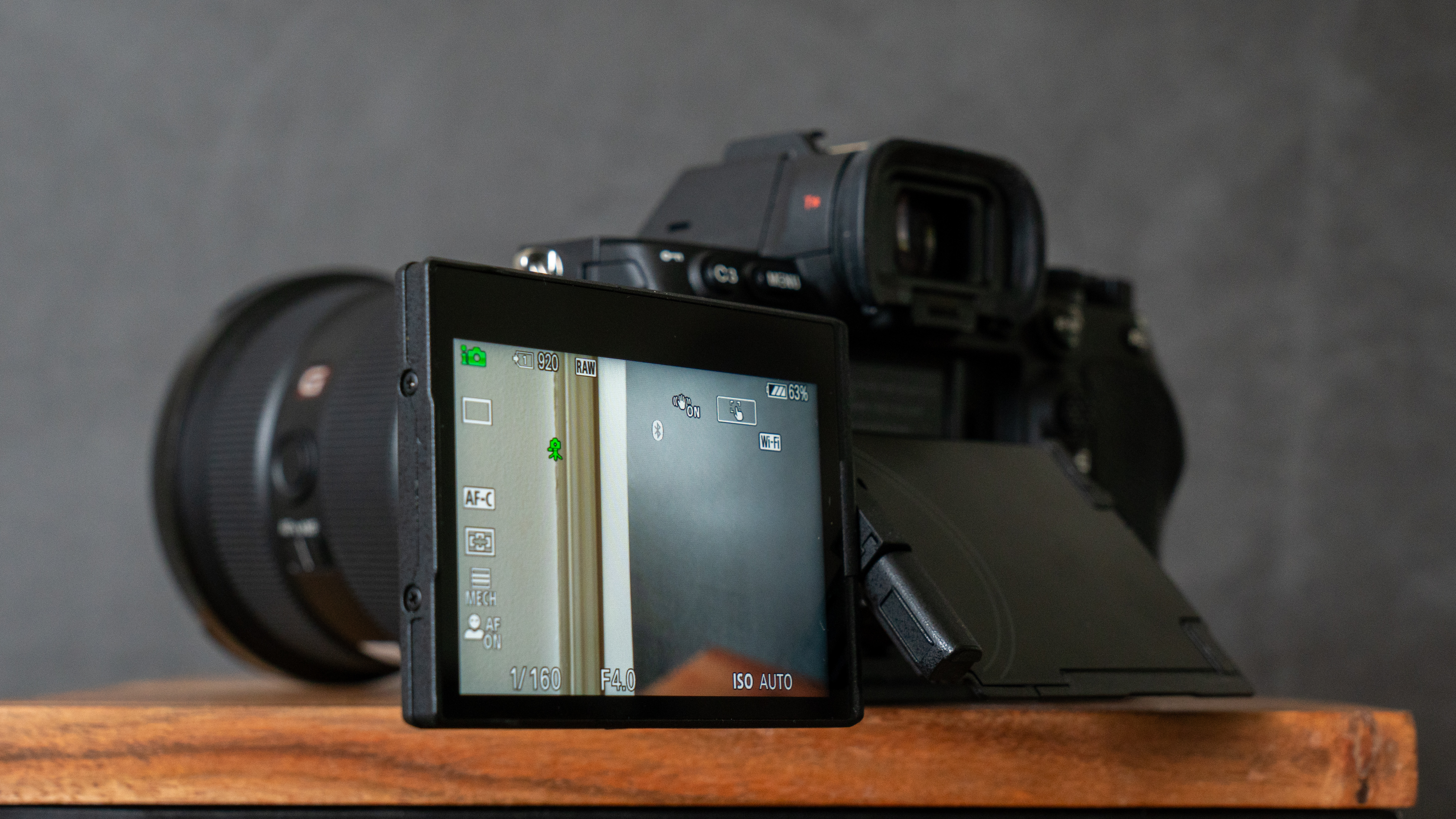 The fully articulating screen on the Sony A7R V is pulled out showing it in use