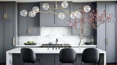 A kitchen with gray cabinets and black counter stools