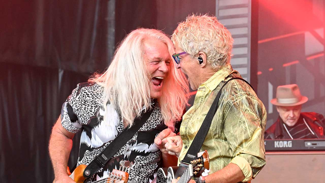 Bruce Hall and Kevin Cronin onstage with REO Speedwagon