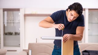 Man fixing a table