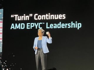 AMD chief executive Lisa Su pictured on stage holding a new EPYC processor at the AMD Advancing AI conference in San Francisco.