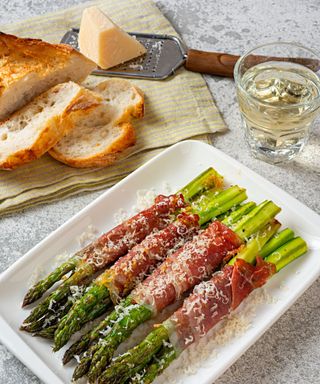 Grilled asparagus wrapped in prosciutto, with shaved parmesan