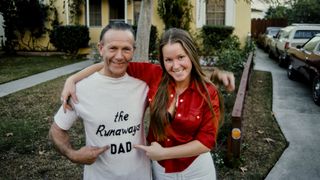 Lita Ford guitarist in "The Runaways" posing with her dad Len at her family home, Los Angeles, California United States, circa 1970s. 