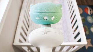 A rear view of the Pixsee Smart Baby Monitor on a stand