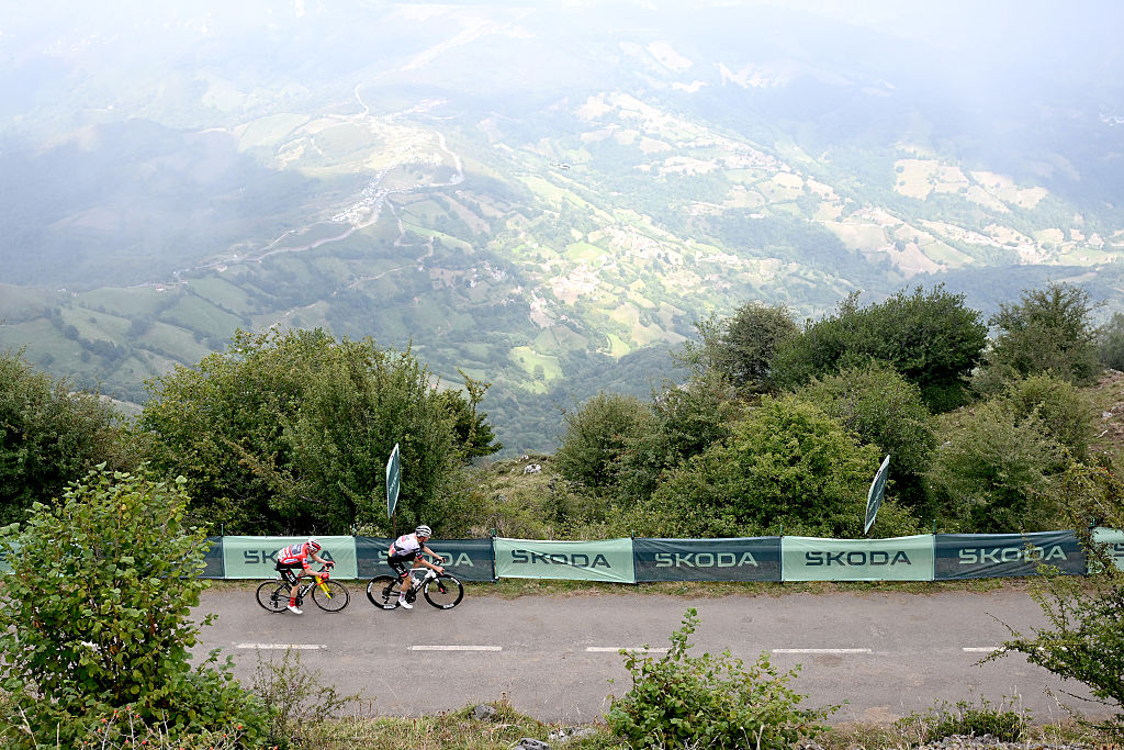 L&#039;ANGLIRU, SPAIN - SEPTEMBER 05: (L-R) Jonas Vingegaard of Denmark and Team Visma | Lease a Bike - Red Leader Jersey and stage winner Joao Almeida of Portugal and UAE Team Emirates - XRG compete climbing to the L&#039;Angliru during the La Vuelta - 80th Tour of Spain 2025, Stage 13 a 203.7km stage from Cabezon de la Sal to L&#039;Angliru 1556m / #UCIWT / on September 05, 2025 in L&#039;Angliru, Spain. (Photo by Dario Belingheri/Getty Images)