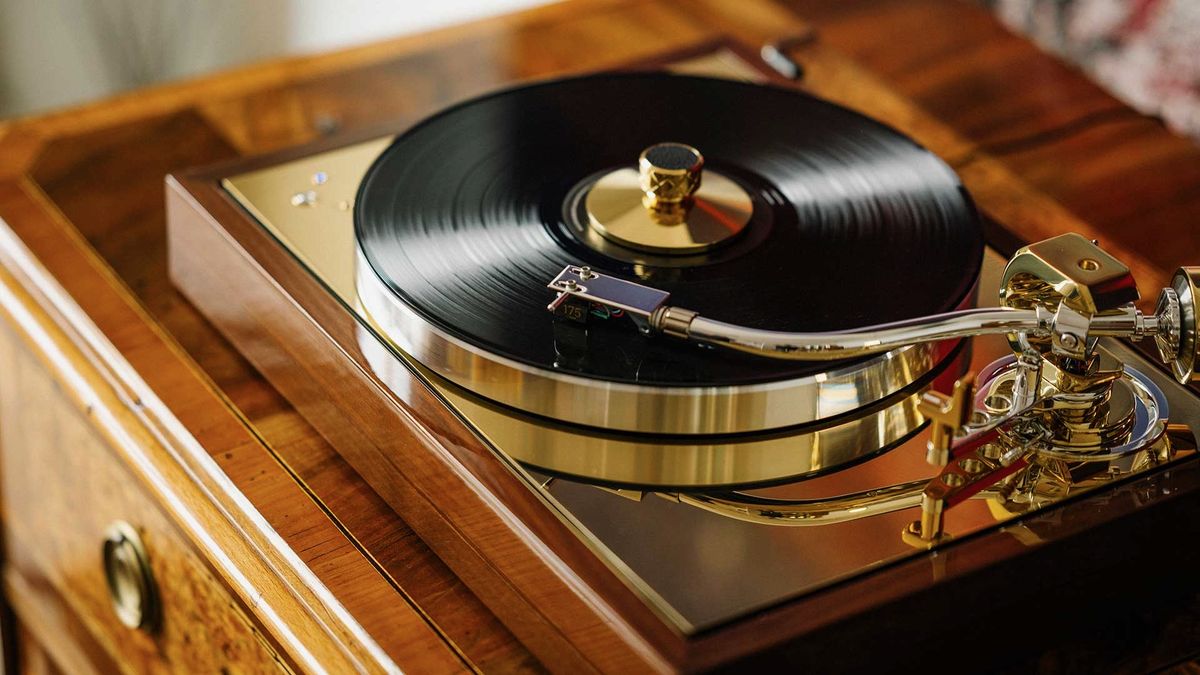 Pro-Ject The Classic Reference record player on a wooden unit.