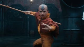 Aang landing and posing with glider in Netflix's Avatar: The Last Airbender.