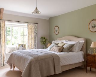 green cottage bedroom with window seat