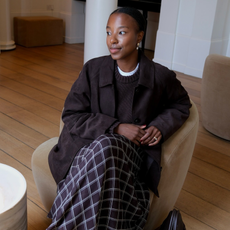 Influencer wearing plaid maxi skirt.