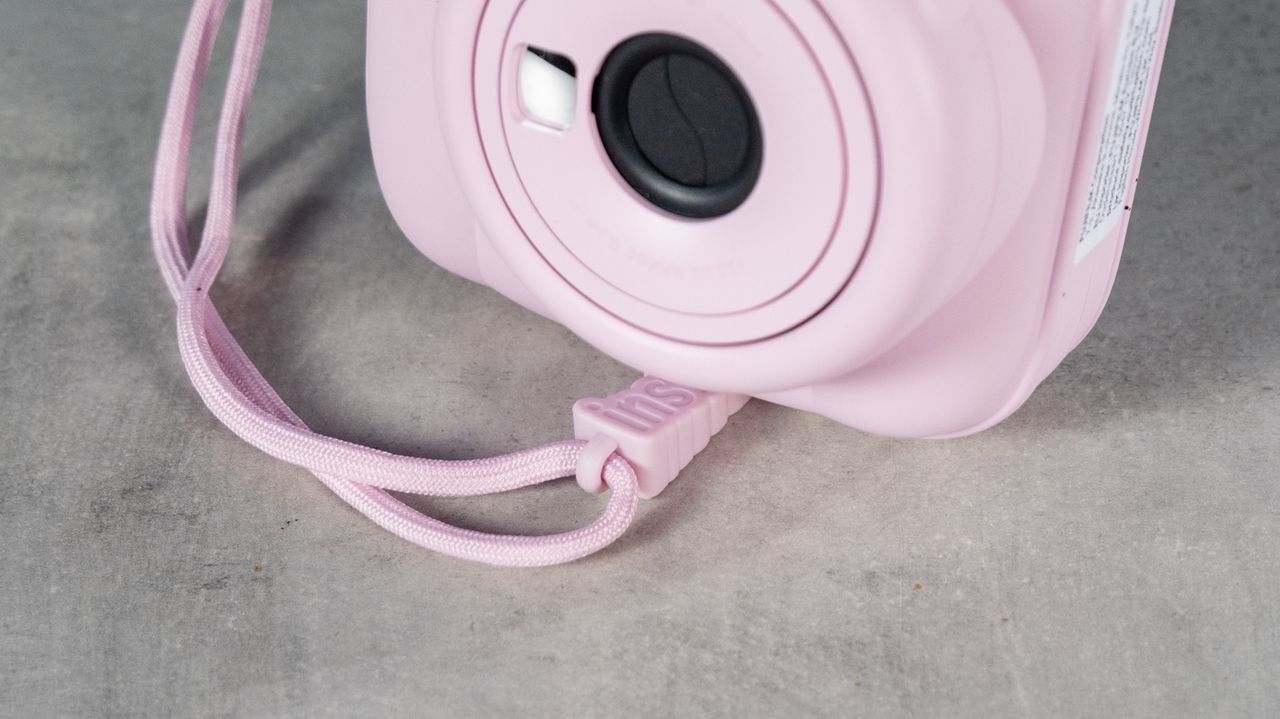 A Candy Pink Fujifilm Instax mini 13 instant camera