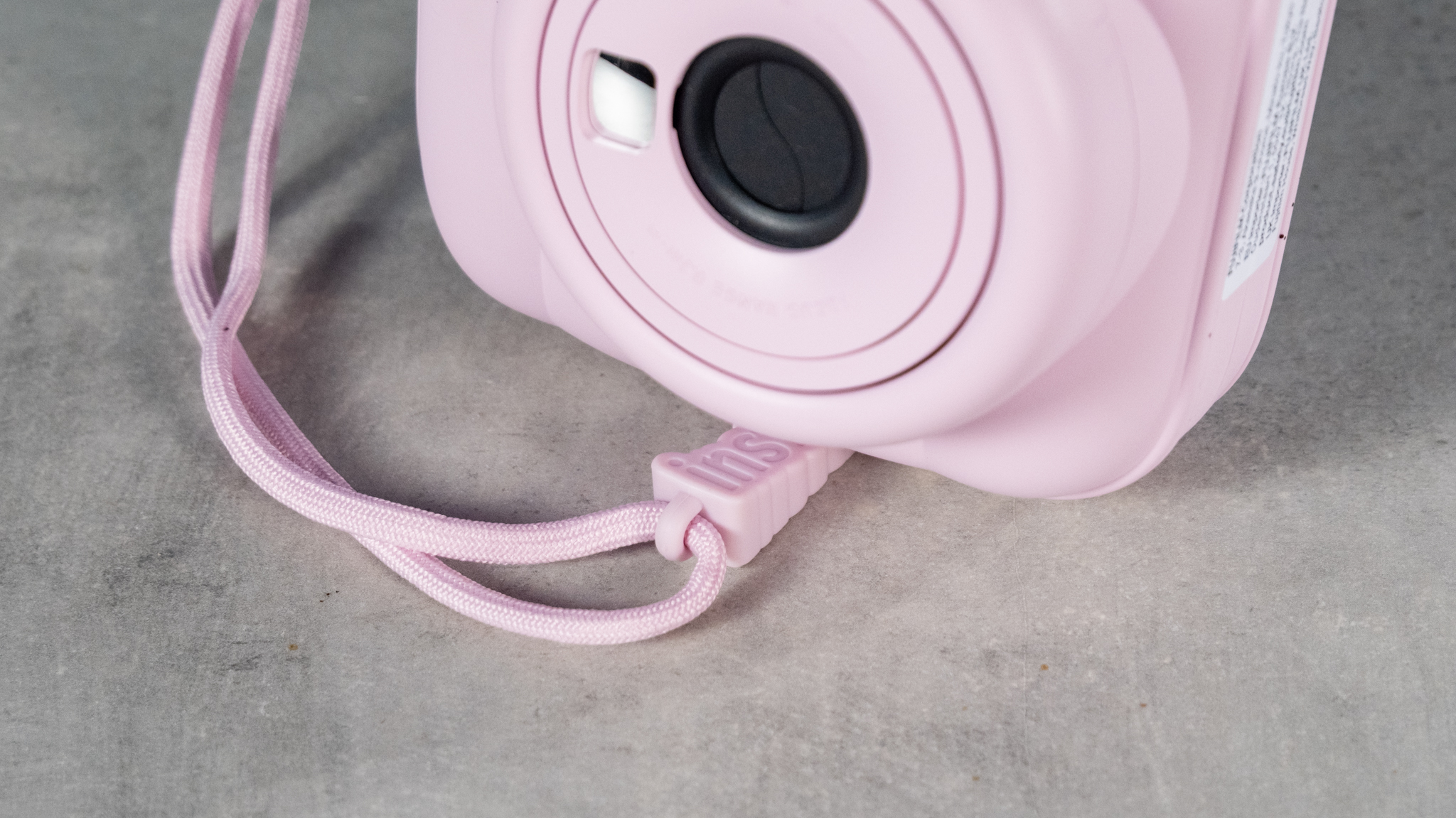 A Candy Pink Fujifilm Instax mini 13 instant camera