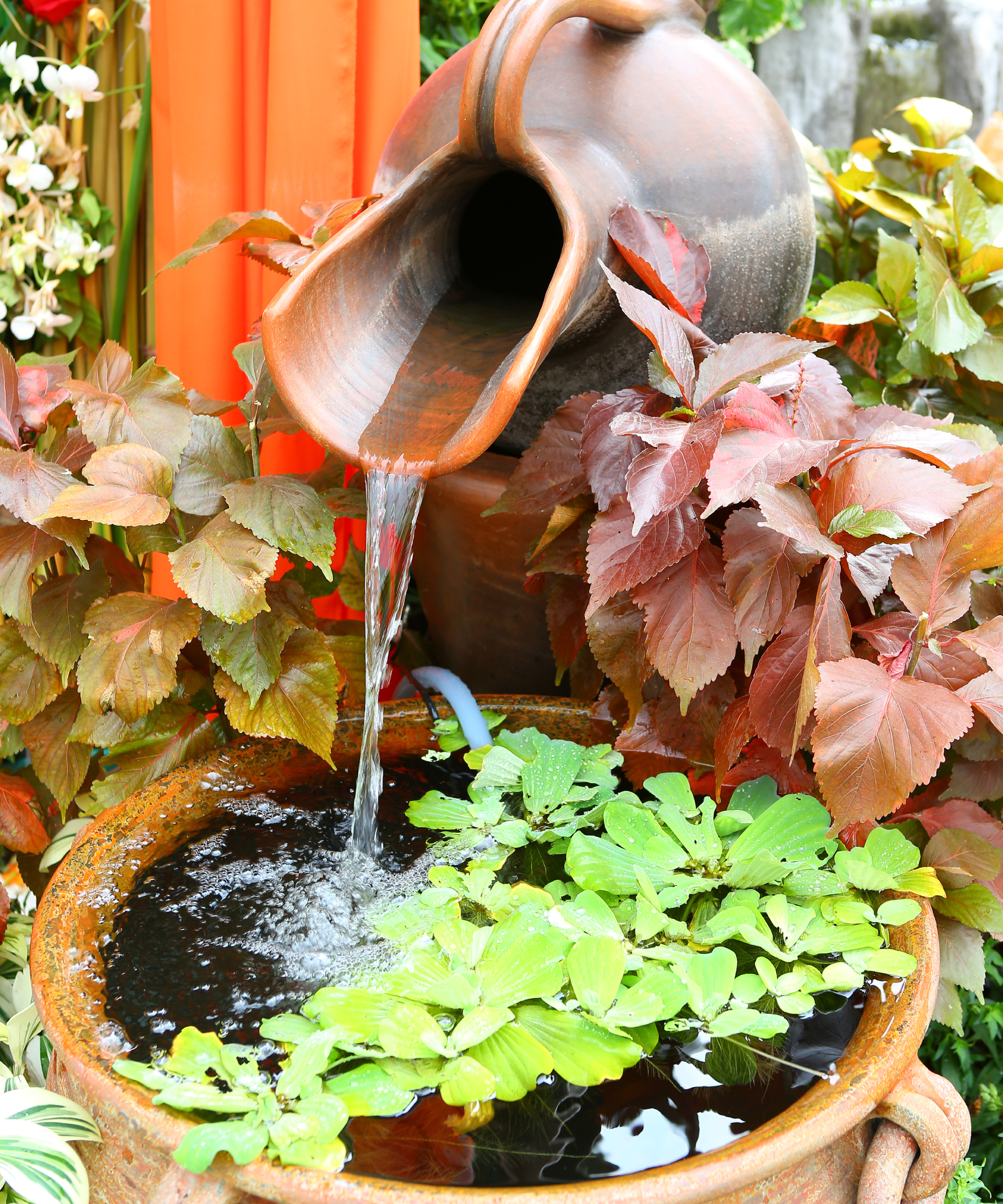 garden water feature with earthen jar