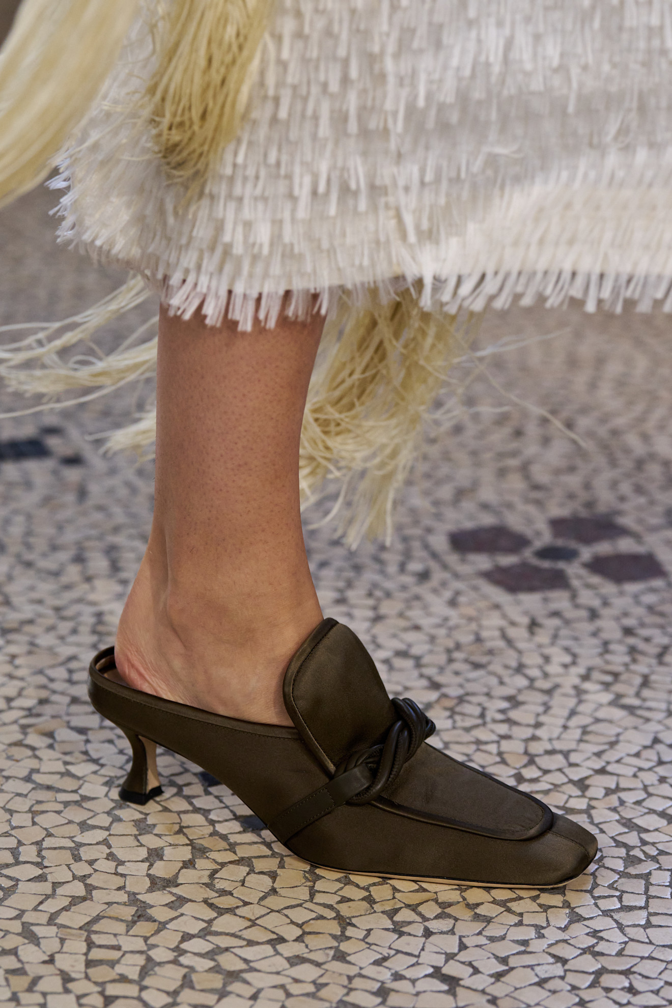 Detail image of a satin shoe on the fall/winter 2026 runway.