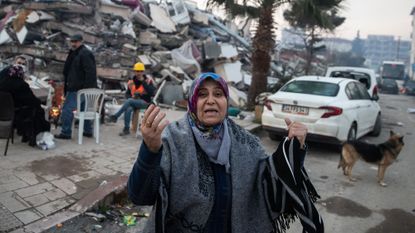 A woman yells as she waits for news of their loved ones, believed to be trapped under collapsed building on February 08, 2023 in Hatay, Turkey. A 7.8-magnitude earthquake hit near Gaziantep, Turkey, in the early hours of Monday, followed by another 7.5-magnitude tremor just after midday. The quakes caused widespread destruction in southern Turkey and northern Syria and were felt in nearby countries.