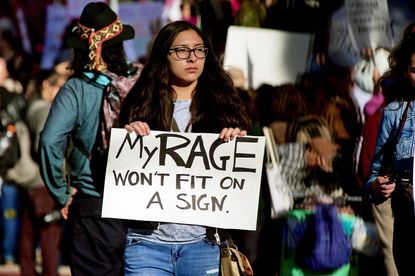 An historic worldwide "Womens March" brings thousands of protesters gathered in front of City Hall downtown Los Angeles.