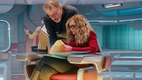 a director and an actress working on a sci-fi spaceship set