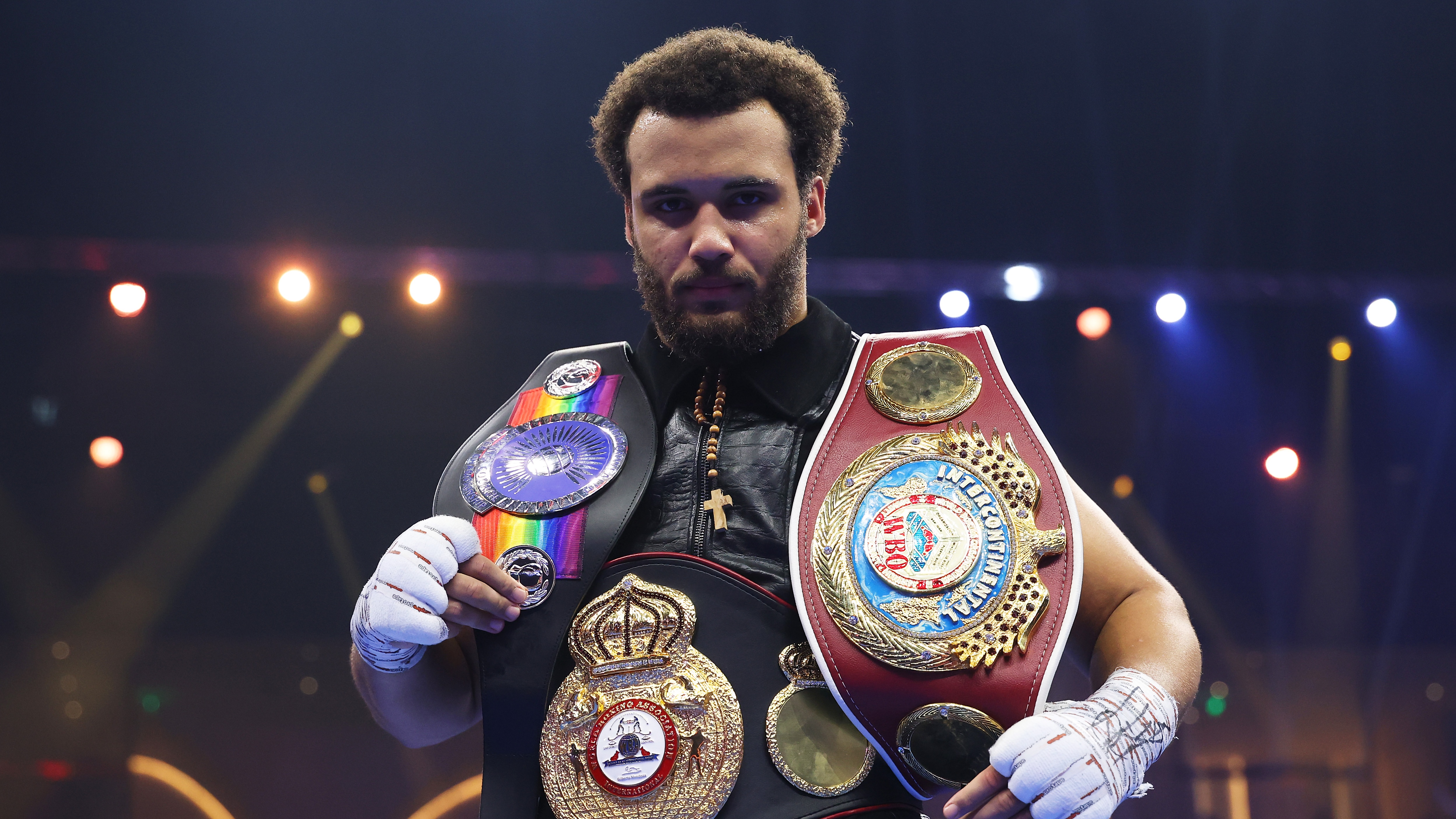 Moses Itauma celebrates victory with his belts following the WBO Inter-Continental, WBA International and Commonwealth Silver Heavyweight titles' fight between Moses Itauma and Demsey McKean as part of Oleksandr Usyk v Tyson Fury 2, Reignited card at Kingdom Arena on December 21, 2024 in Riyadh, Saudi Arabia. 