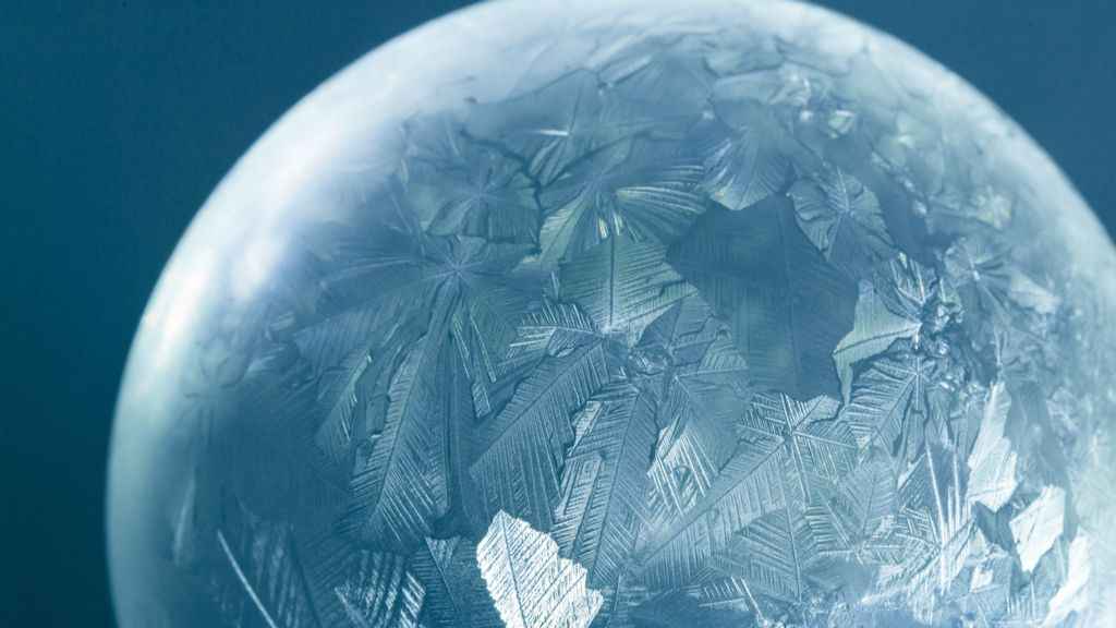 Soap bubble freezes into an iridescent snow globe in cool new video