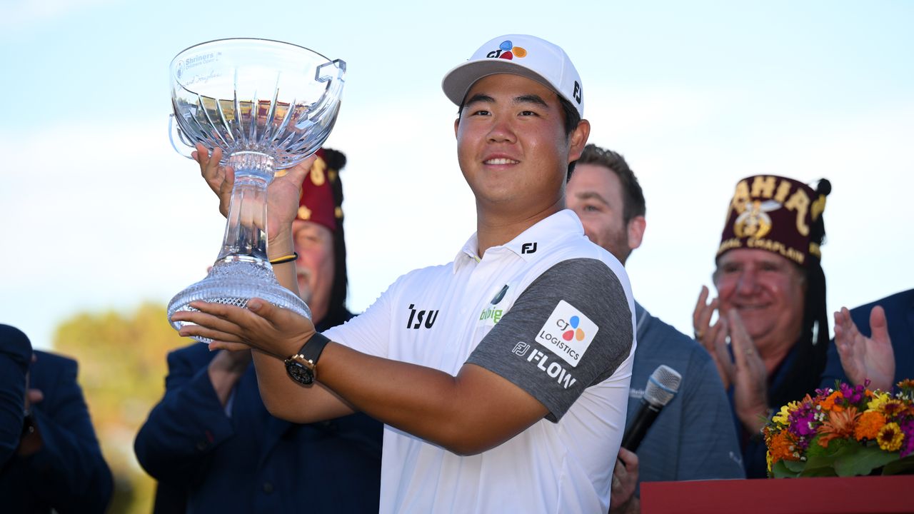 Tom Kim poses with the trophy after winning the 2022 Shriners Children&#039;s Open