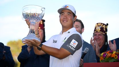 Tom Kim poses with the trophy after winning the 2022 Shriners Children's Open