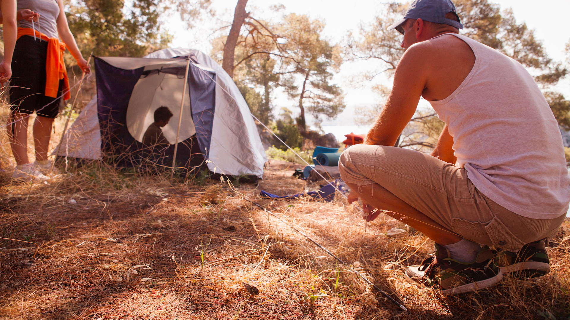 Family pitching a tent