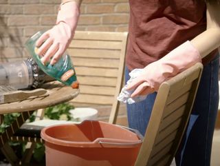 how to clean outdoor furniture - mix soapy water
