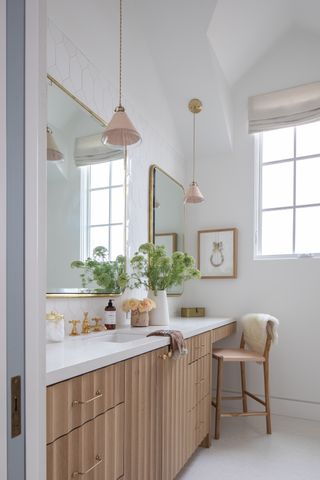 bathroom with vanity area and high chair