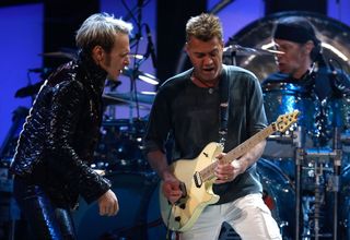 (from left) David Lee Roth, Eddie Van Halen, and Alex Van Halen perform onstage in East Rutherford, New Jersey on May 13, 2008