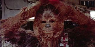Chewbacca on Millennium Falcon arms behind head