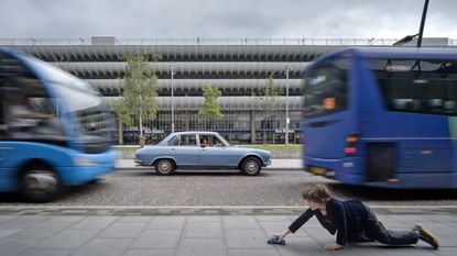 A Time ⋅ A Place: An exploration of automotive and architectural design: image of Preston Bus Station and blue car