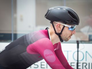 Tom riding in the wind tunnel wearing the S-Works Evade III helmet