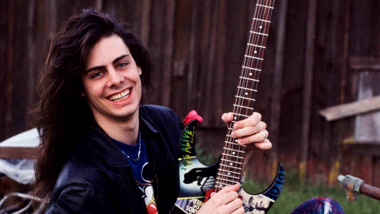 Richie Kotzen posing for a photograph with a guitar in 1989