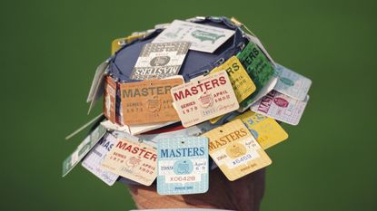 A patron at the Masters seen with tickets clipped to his hat