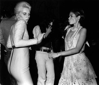 Angie Bowie dancing with Bianca Jagger at the Ziggy Stardust retirement party.
