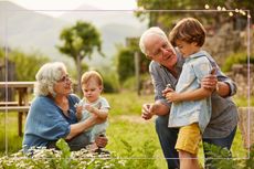 Grandparents in the garden with two grandchildren