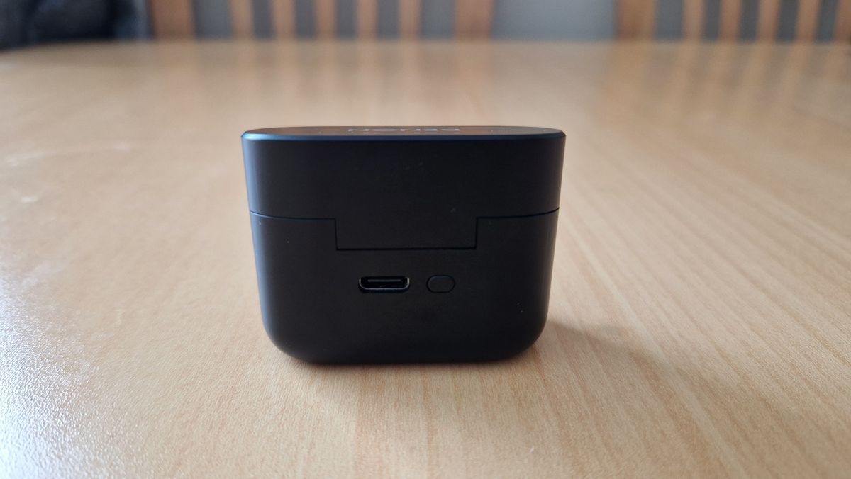 Denon Noise Cancelling Earbuds case back showing the USB-C connection and multi-function button