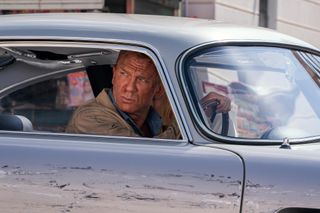 B25_31842_RC2James Bond (Daniel Craig) and Dr. Madeleine Swann (Léa Seydoux)drive through Matera, Italy in NO TIME TO DIE, a DANJAQ and Metro Goldwyn Mayer Pictures film.Credit: Nicola Dove