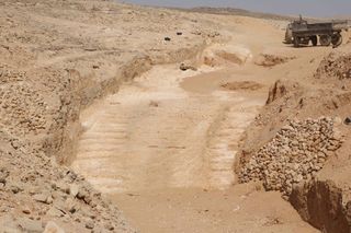 This 4,500-year-old system used to pull alabaster stones up a steep slope was discovered at Hatnub, an ancient quarry in the Eastern Desert of Egypt. Two staircases with numerous postholes are located next to this ramp. An alabaster block would have been