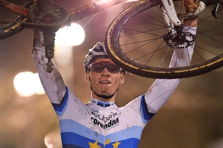 Mathieu van der Poel lifts his bike after winning Superprestige Diegem