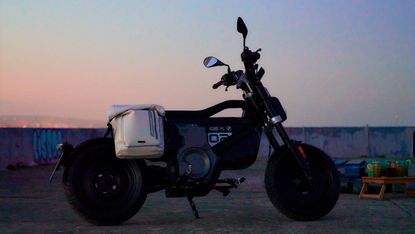BMW CE 02 electric scooter by BMW Motorrad at dusk