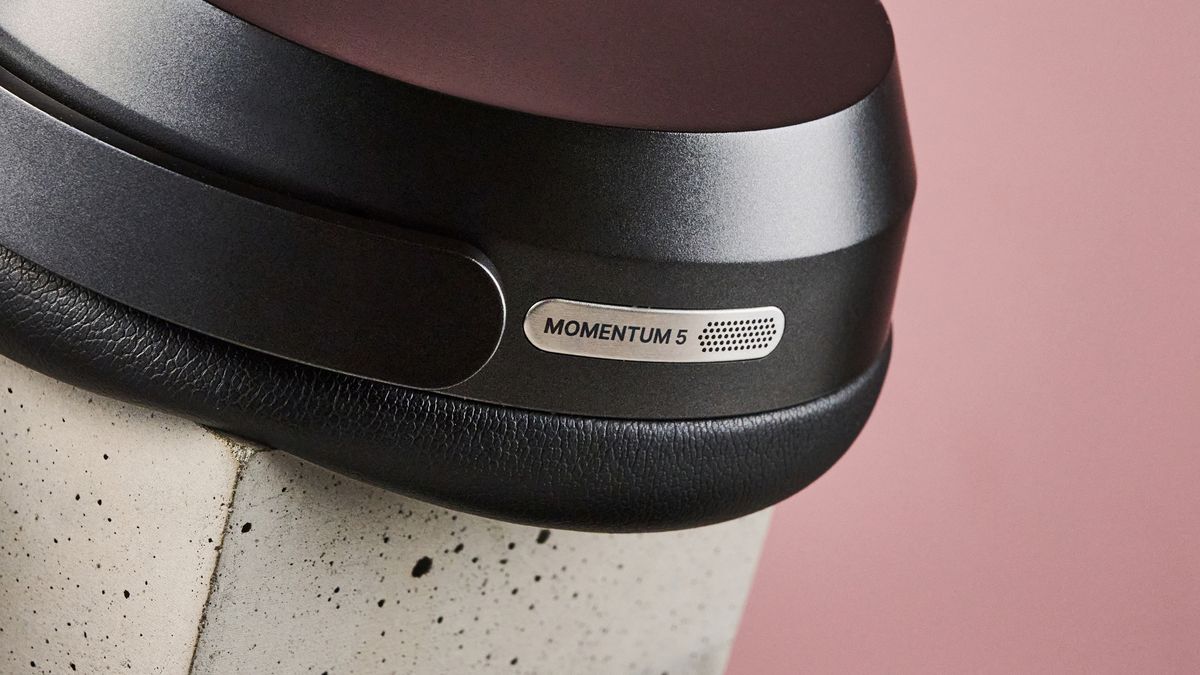 A closeup of the Sennheiser logo on one of the Sennheiser Momentum 5's earcups.