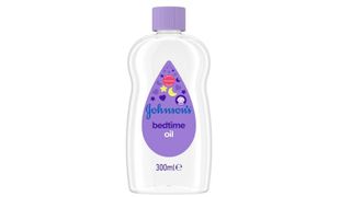 bottle of johnsons baby bedtime oil with purple accents as part of the baby massage oils round up