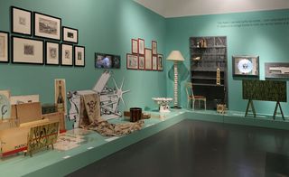 Collections of work from the Fornasetti atelier crowd the exhibition space