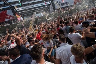 England football fans celebrate after England score their second goal in the England V Sweden quater final match in the FIFA 2018 World Cup Finals at Croydon Boxpark on July 7, 2018 in London, England. World Cup fever is building among England fans after reaching the quater finals in Russia.