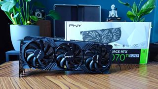 PNY version of Nvidia GeForce RTX 4070 Ti Super next to box on wood table